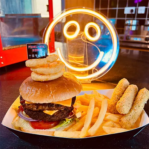 Double cheese burger with fries and onion rings