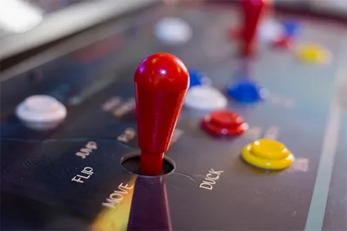 Close up of arcade machine controls